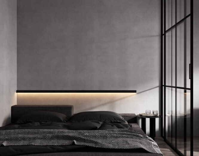 onkere slaapkamer met strakke, zwarte afwerking en indirecte LED-verlichting op de muur, gerealiseerd door JRC Afbouw voor een moderne en luxe uitstraling