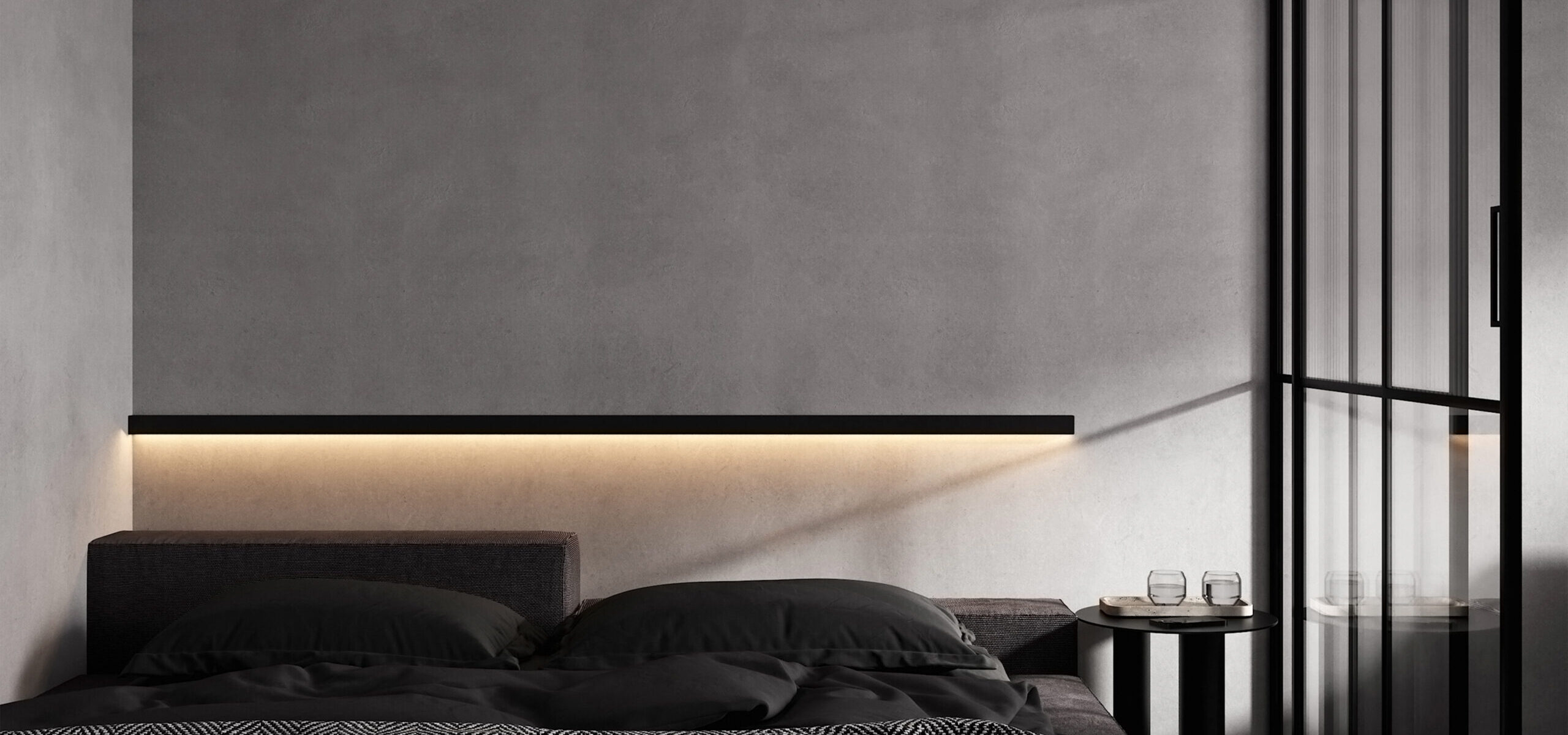 Moderne slaapkamer met ingebouwde LED-verlichting en stijlvolle zwarte details, afgewerkt door JRC Afbouw voor een strak en sfeervol interieur